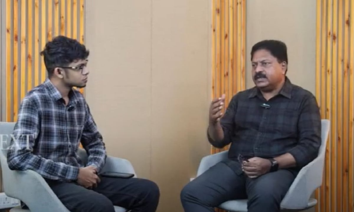 Sivarajah Ramanathan, at right, speaking with an interviewer