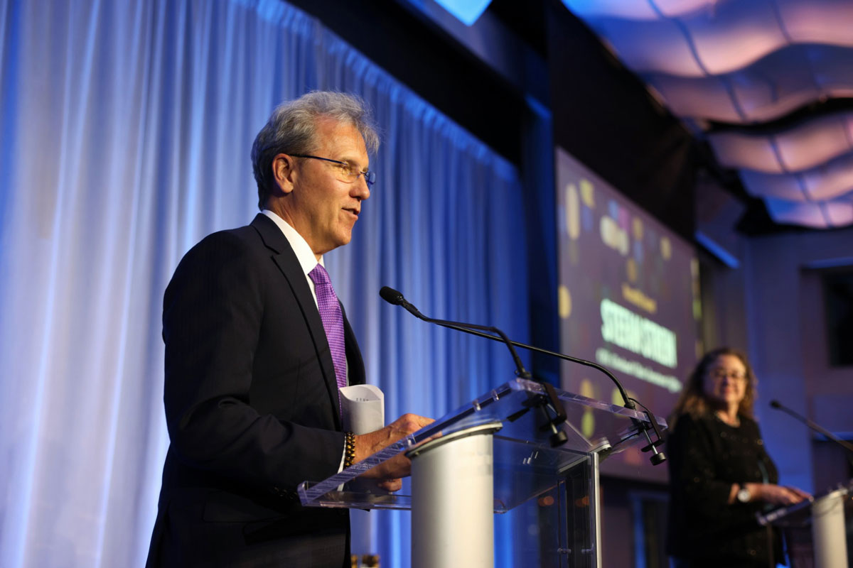 Stefan Strein speaking at a lectern during the 2025 CIO Industry Innovation Awards
