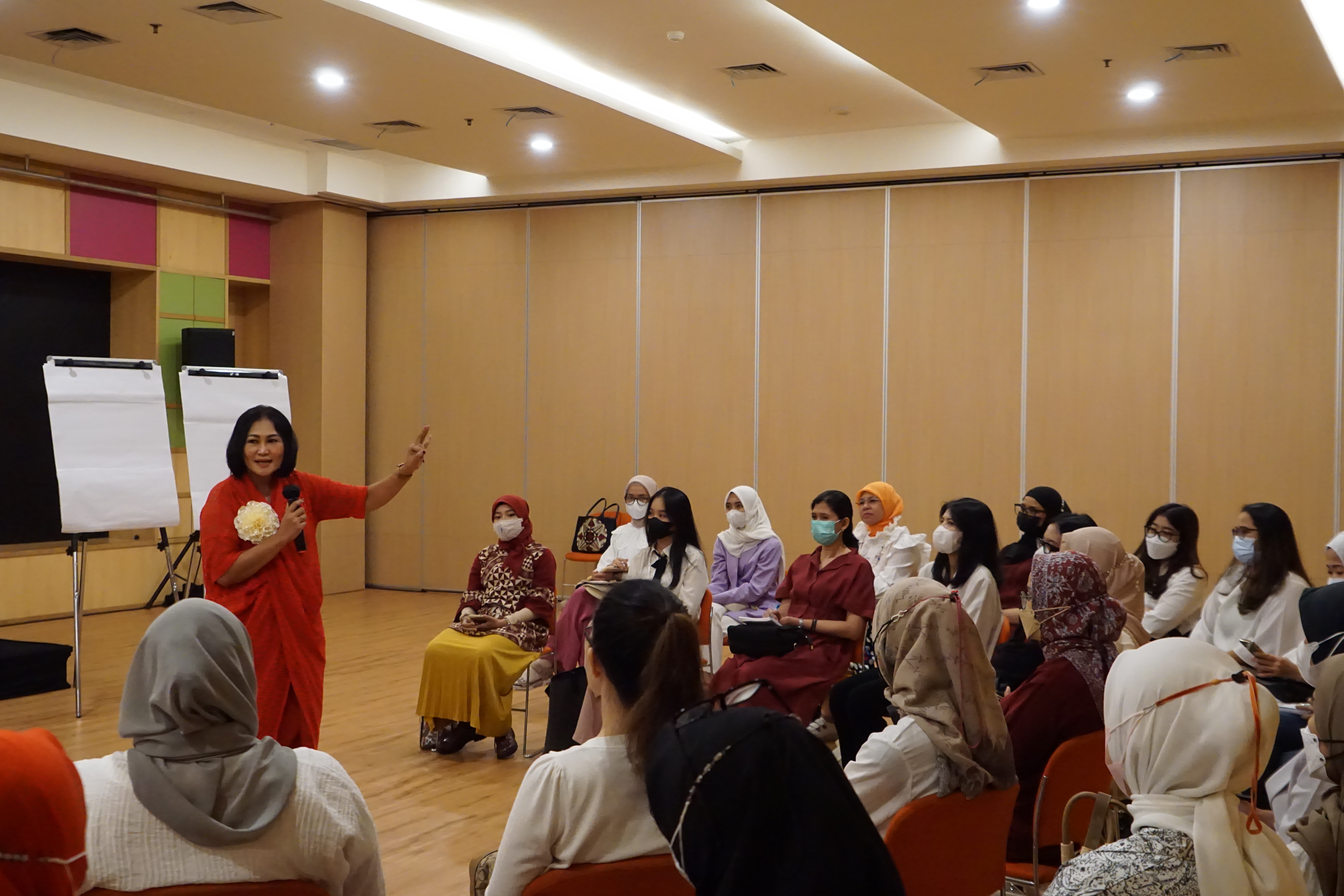 Women seated in a discussion circle around a speaker at a Stellar Women gathering