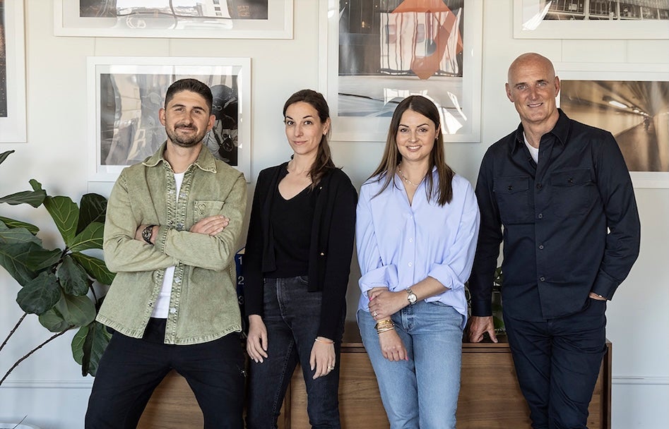 Paul Anastasiadis, Steph Lund, Andrea Nirsimloo and Steve Martin standing together in a New York office