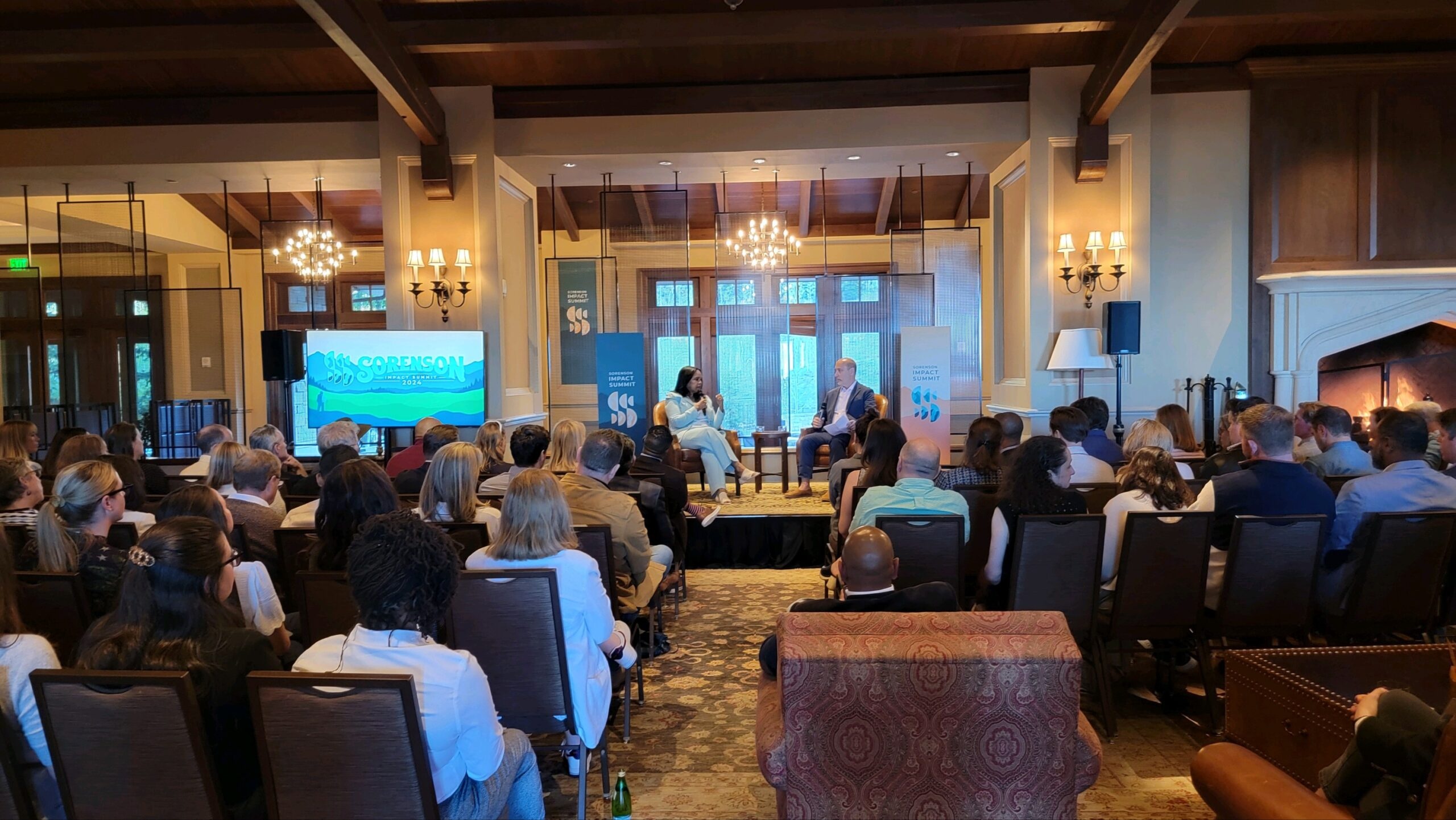 Audience listening to a discussion at the 2024 Sorenson Impact Summit in Utah