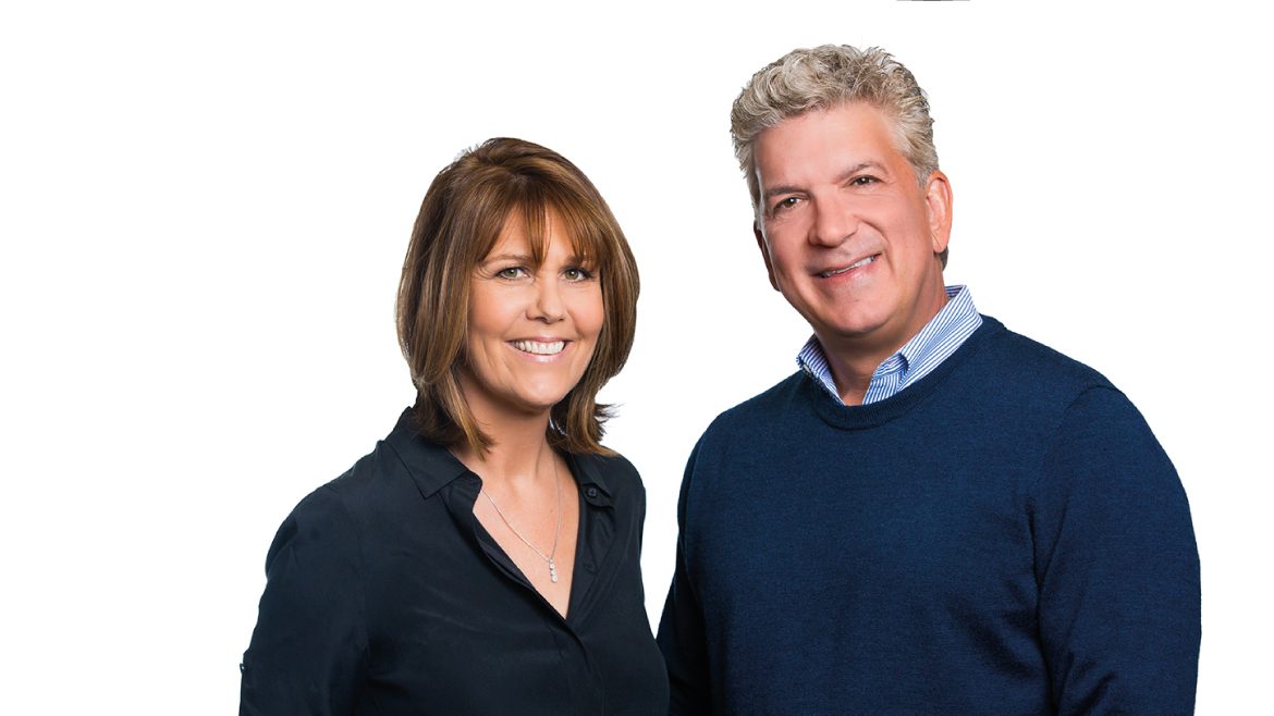 Stephanie and Rasha Drachkovitch standing together against a white background
