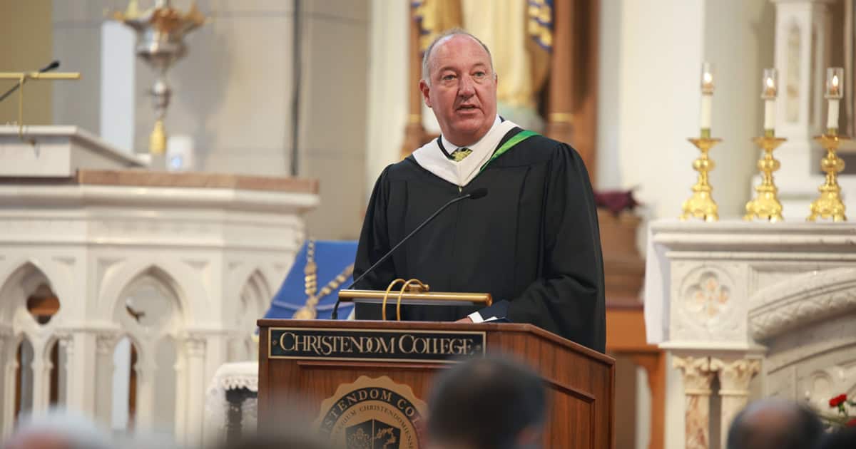 Stephen O’Keefe speaking at a lectern during George Harne’s installation at Christendom College