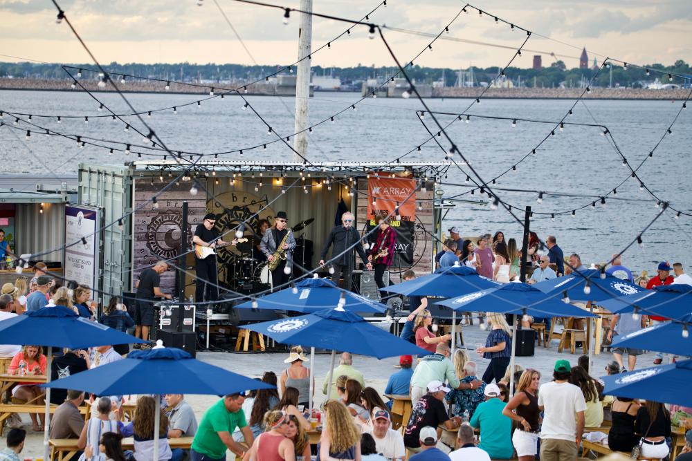 Guests gathering outdoors by the water at Cisco in New Bedford