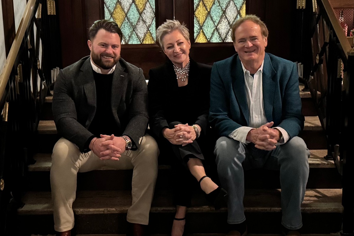 Patrick Sweet, Brenda Andresen and founder Chuck Stephens seated together at a company gathering
