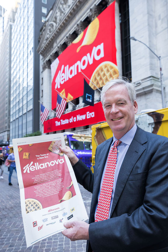 Steve Cahillane holding a Kellanova announcement outside the New York Stock Exchange in October 2023