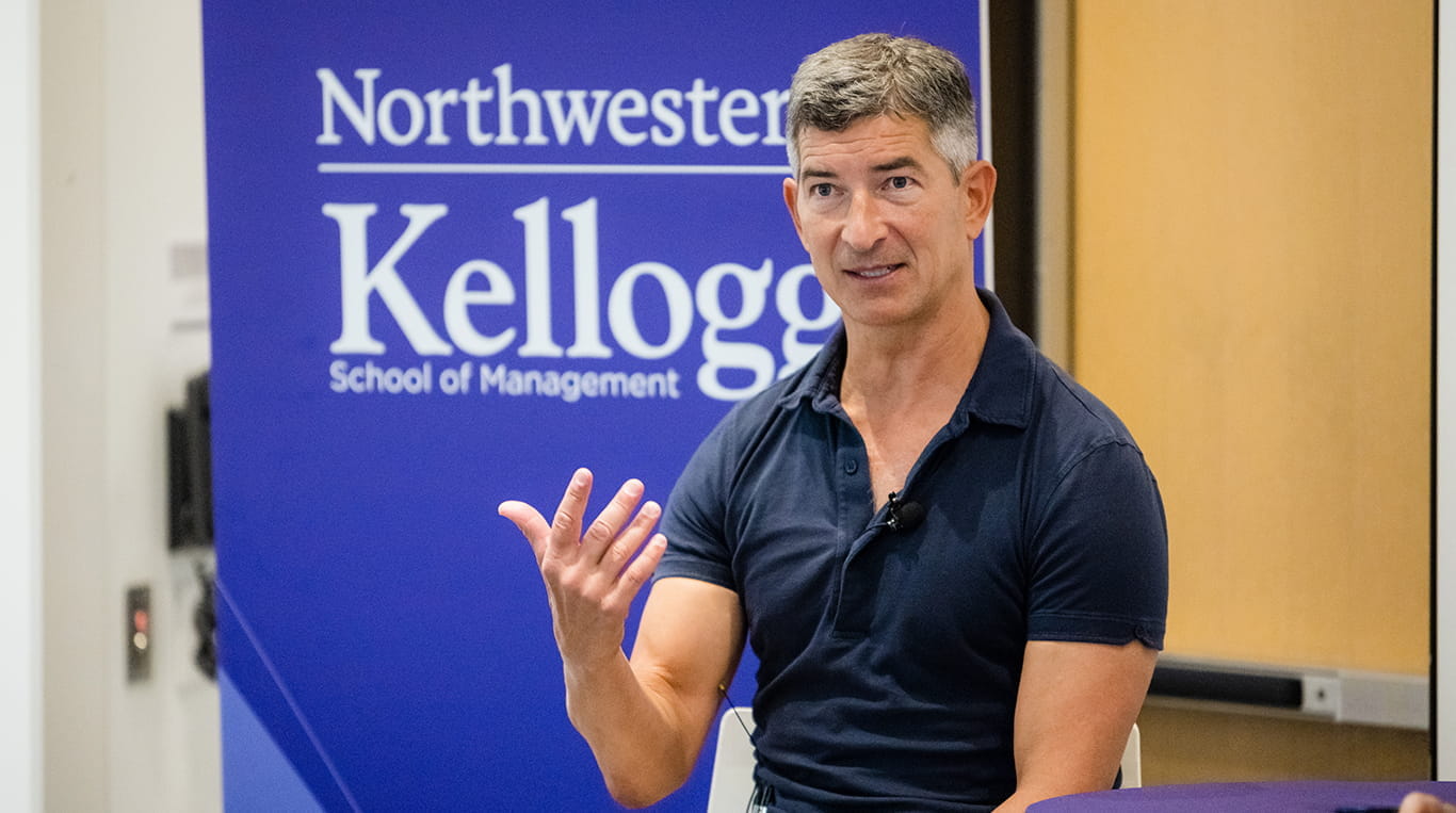 Steve Hafner speaking at Northwestern’s Kellogg School of Management, gesturing during a discussion.