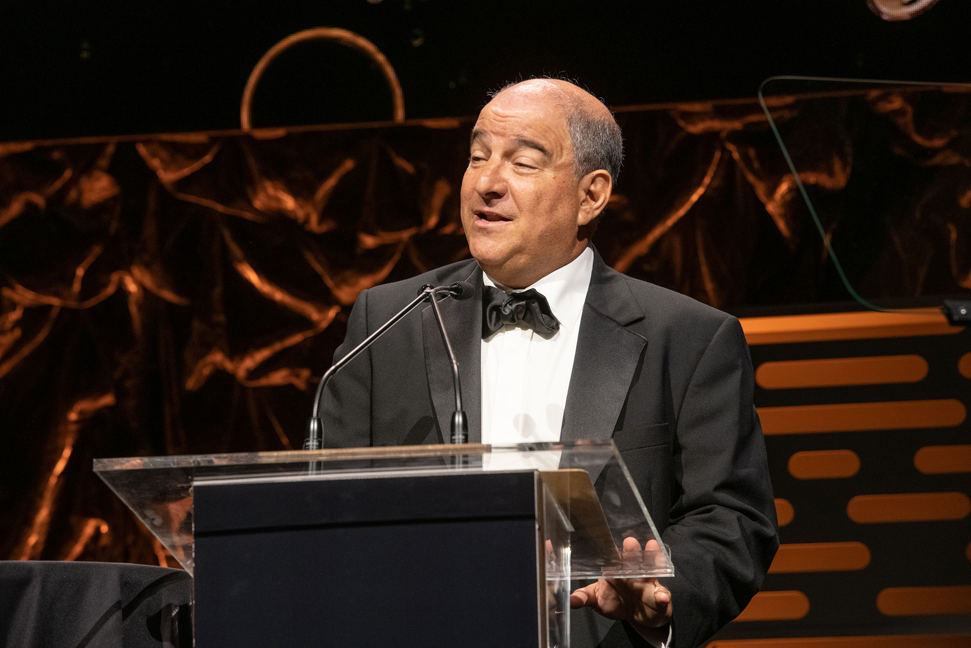 Steve Miron speaking at a lectern at the 2022 Broadcasting+Cable Hall of Fame celebration