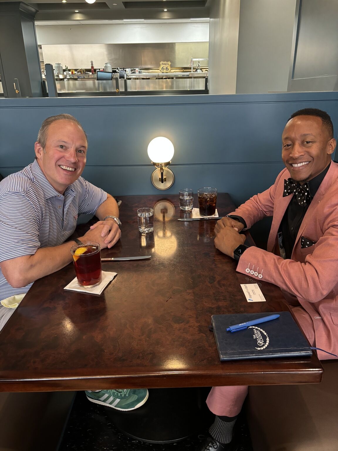Steve Mitchell, left, and Garry Clark seated at a restaurant table