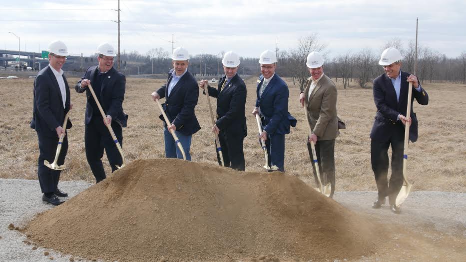 Steve Page, far left, and six other leaders wearing hard hats and holding shovels at the 2016 Erlanger groundbreaking