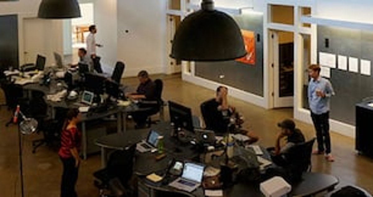 The ActiveProspect office in Austin, with team members working at shared desks