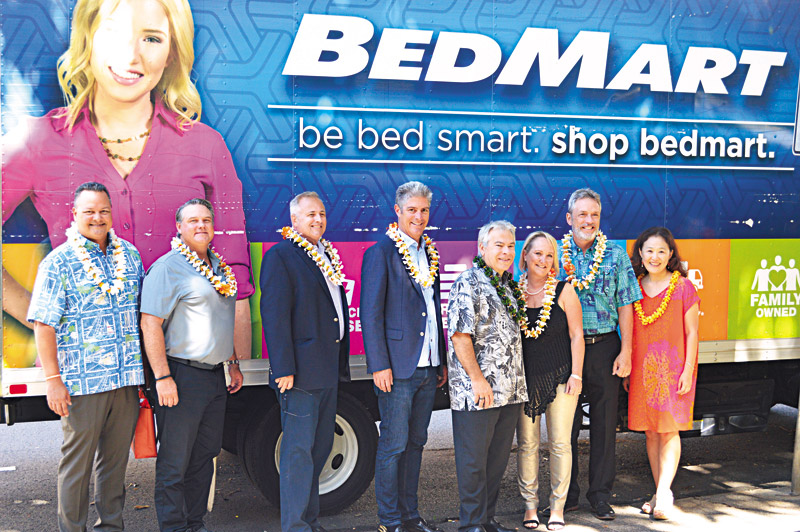Steve Rusing, fourth from left, joins BedMart, logistics partners and YWCA O‘ahu representatives at a mattress donation event.