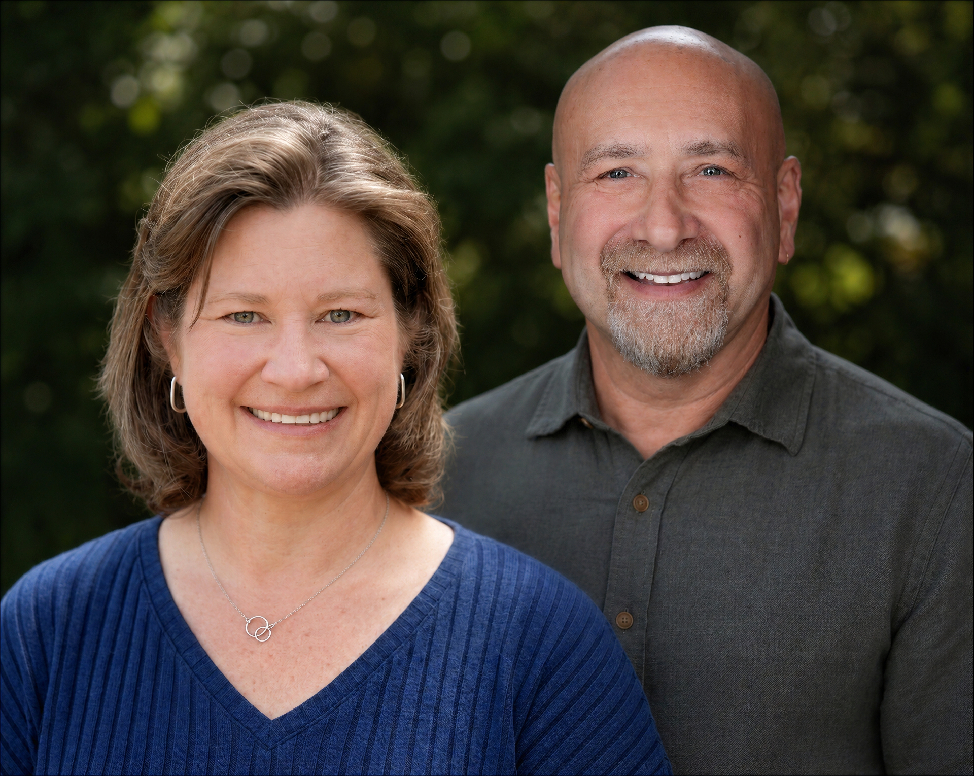 Sarah LaLiberte, left, and Steve Schuster smiling outdoors