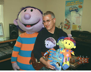 Steve Syatt seated among Shushybye characters and recording equipment