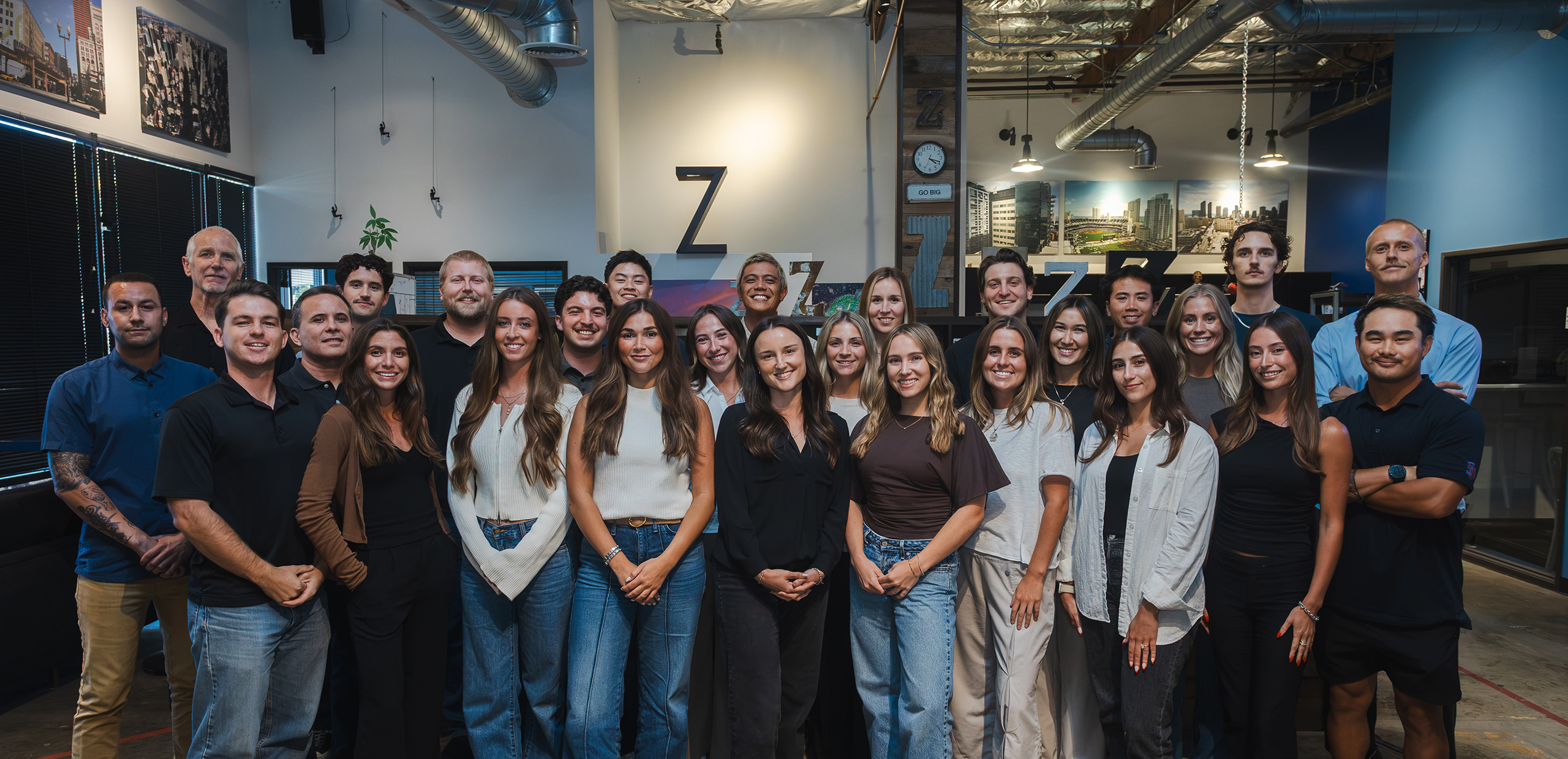 Steve Weber, in the back row near the left, with the ZDigital team in their office.