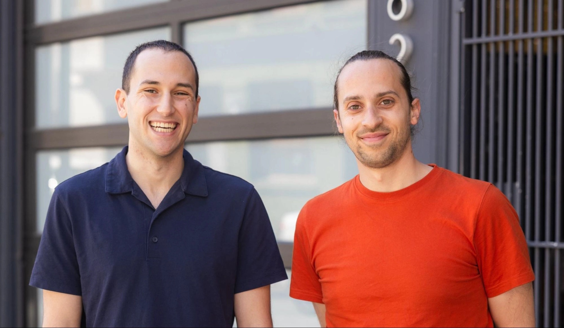 Freshpaint co-founders Michael Malis on the left and Steven Fitzsimmons on the right, standing outside a building.