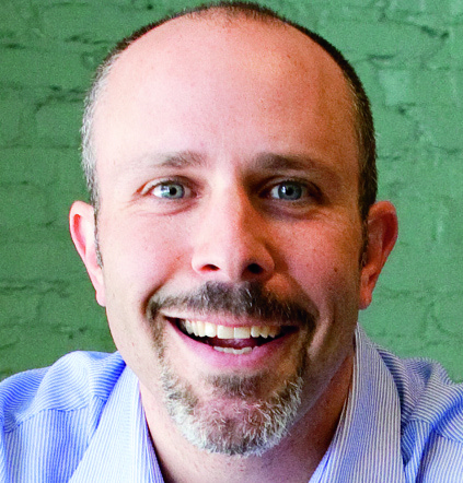 Steven Gold smiling in the portrait published with Giant’s July 2012 agency profile
