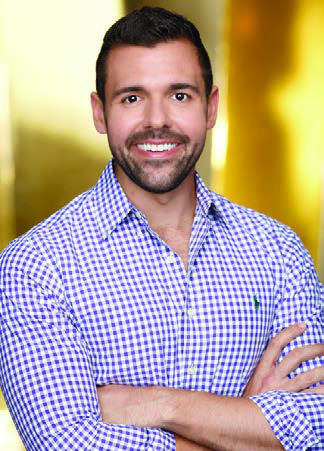 Steven Levine in a checked shirt, in the archival portrait accompanying his 2018 NYU Stern profile