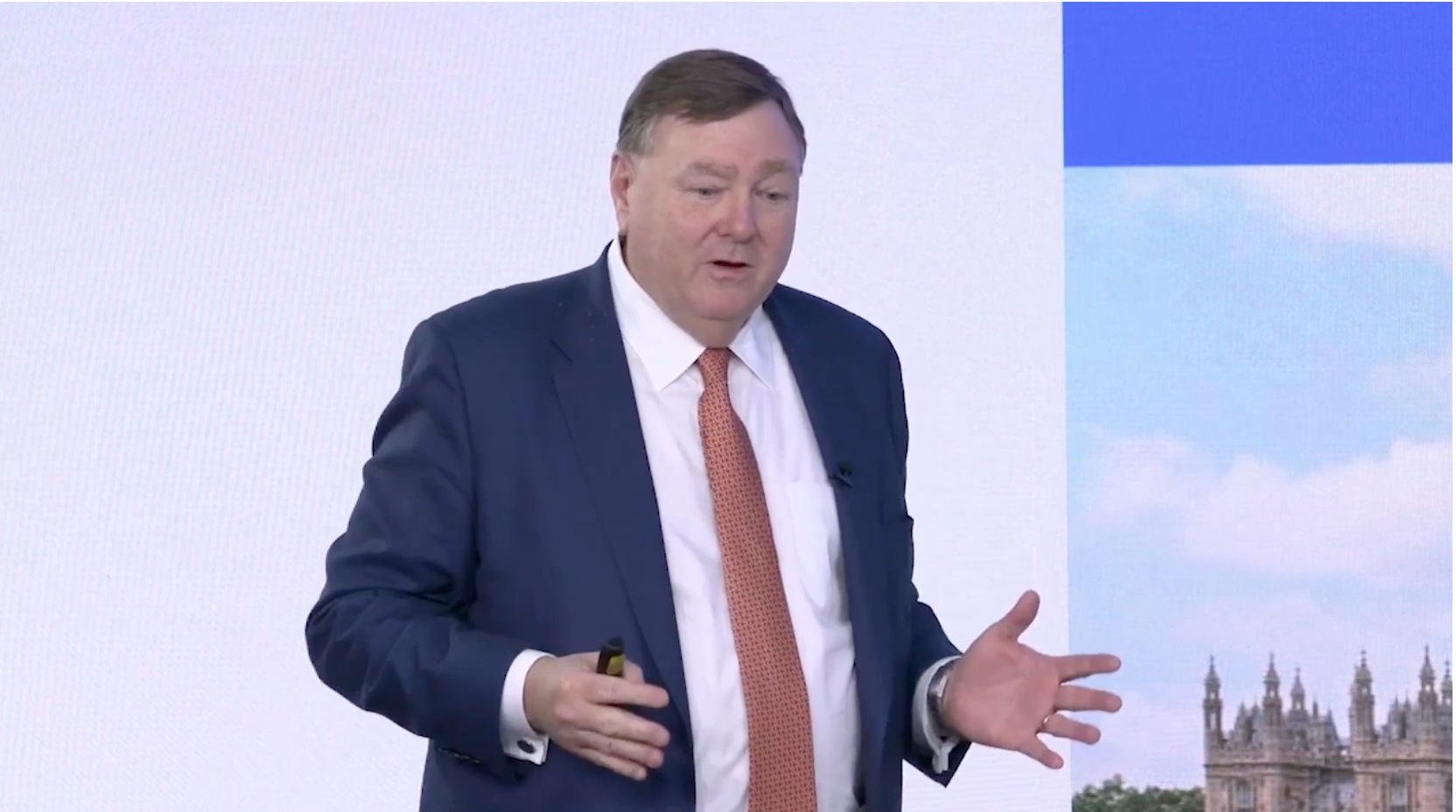 Stewart Hall speaking with open hands at PPHC’s January 2025 capital markets event in London