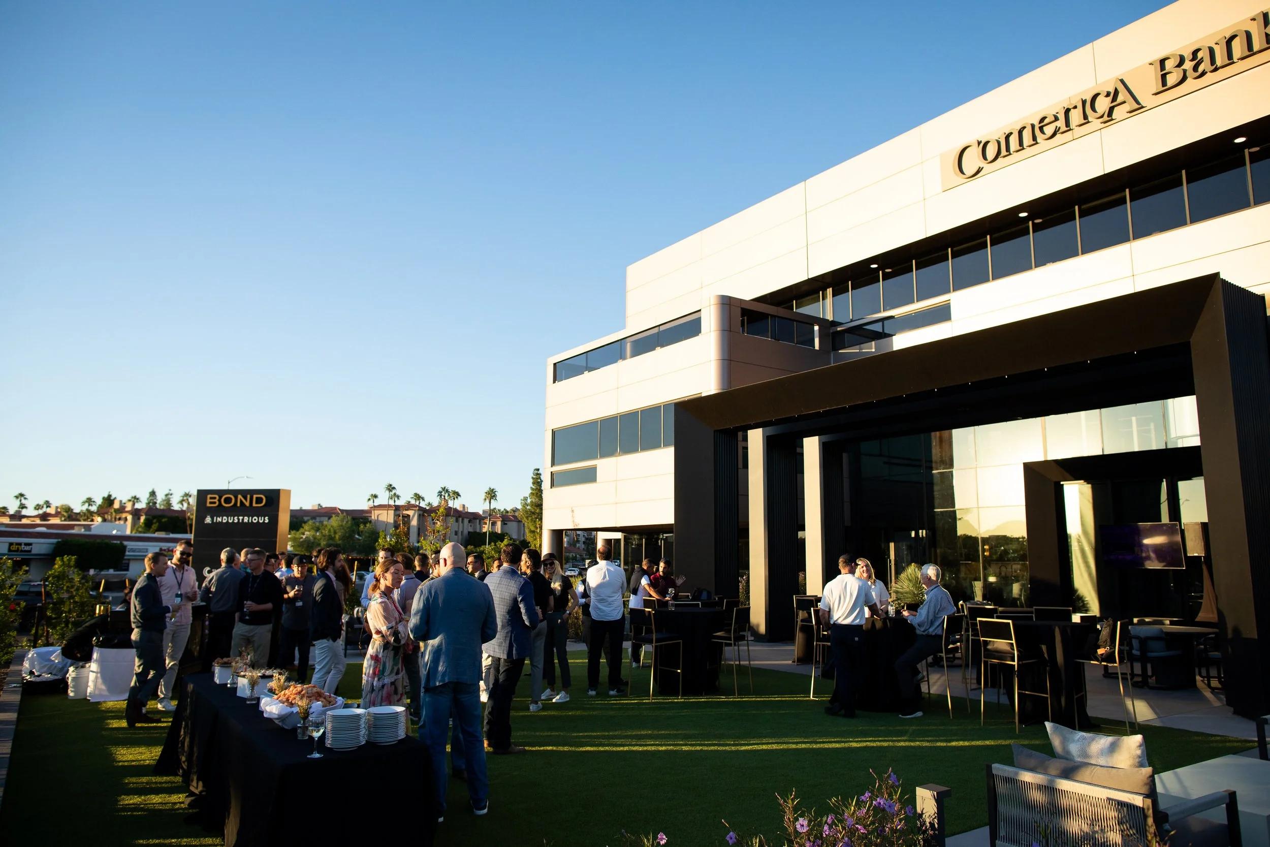 Attendees talking outdoors at the Stormbreaker annual meeting