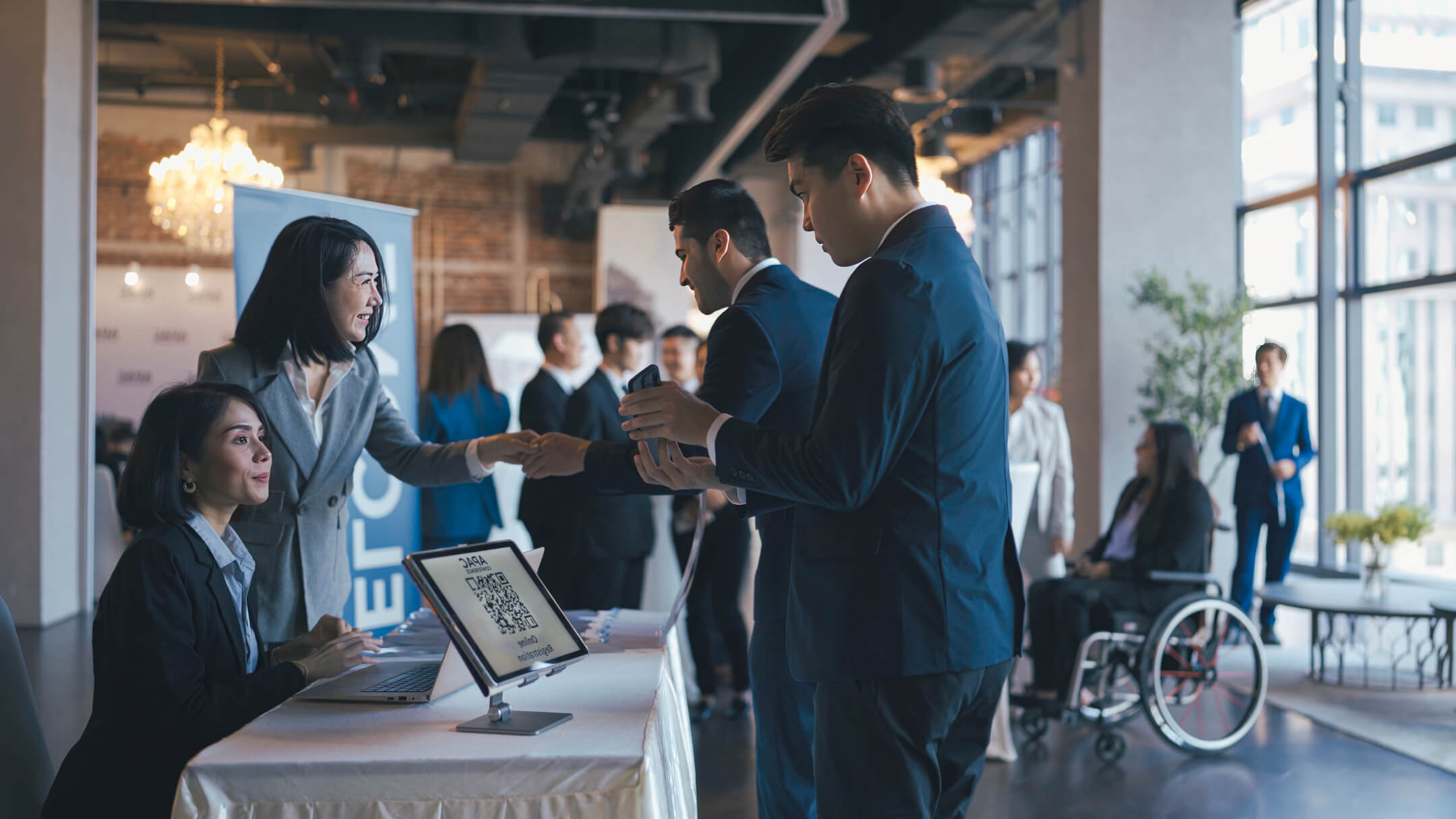 People checking in at a conference event