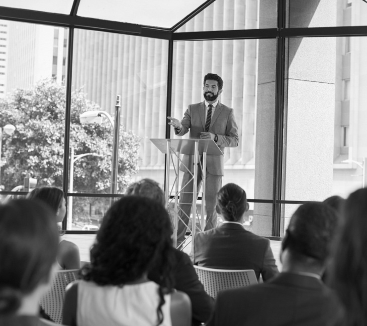 A Houston Business Forum gathering in a formal meeting room