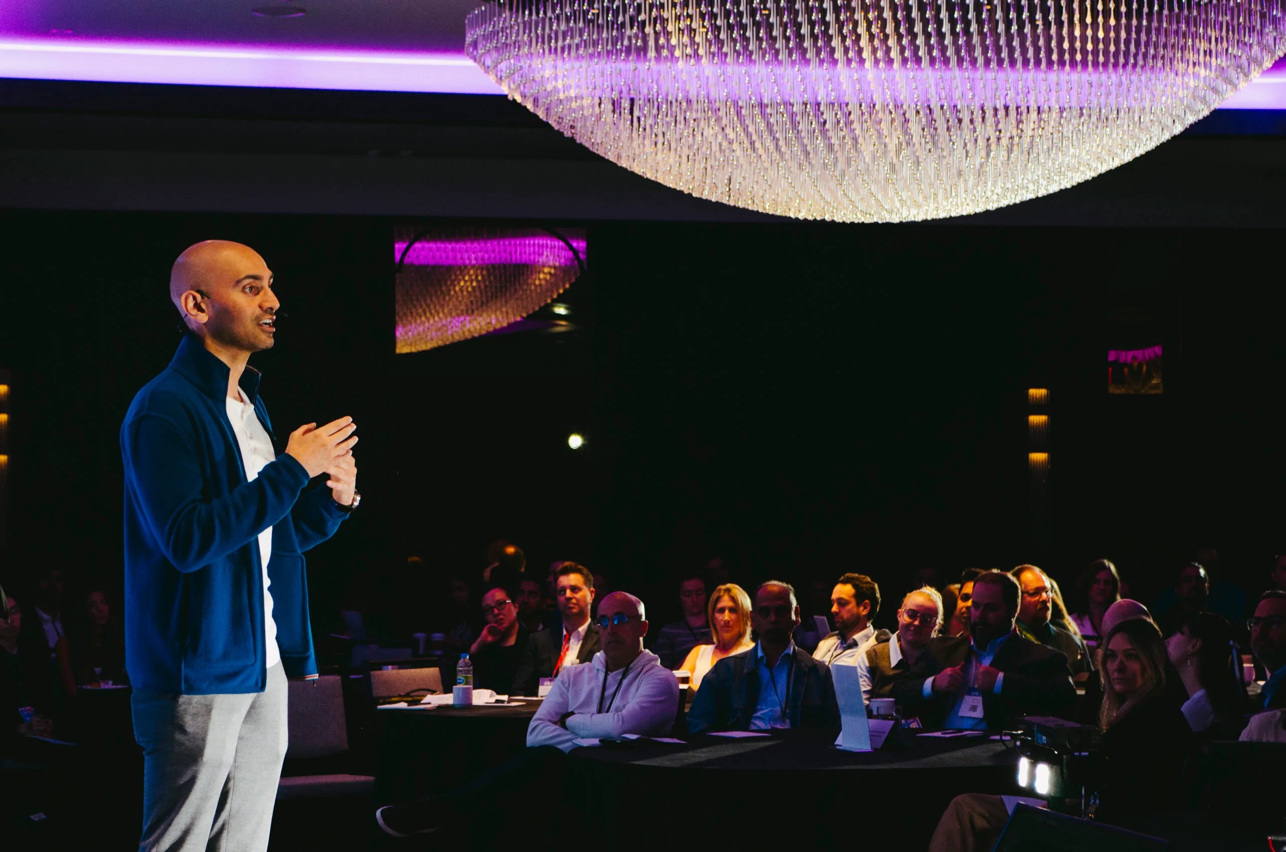 A speaker addresses an audience at a Strategy Institute conference