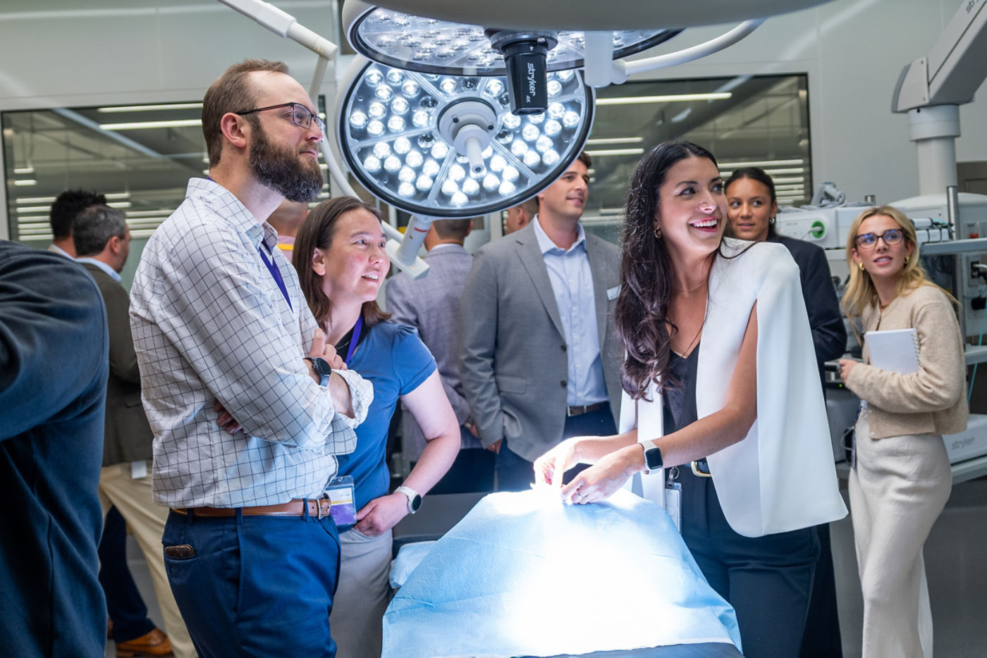 Participants gathered around operating room equipment at Stryker’s iBuild workshop
