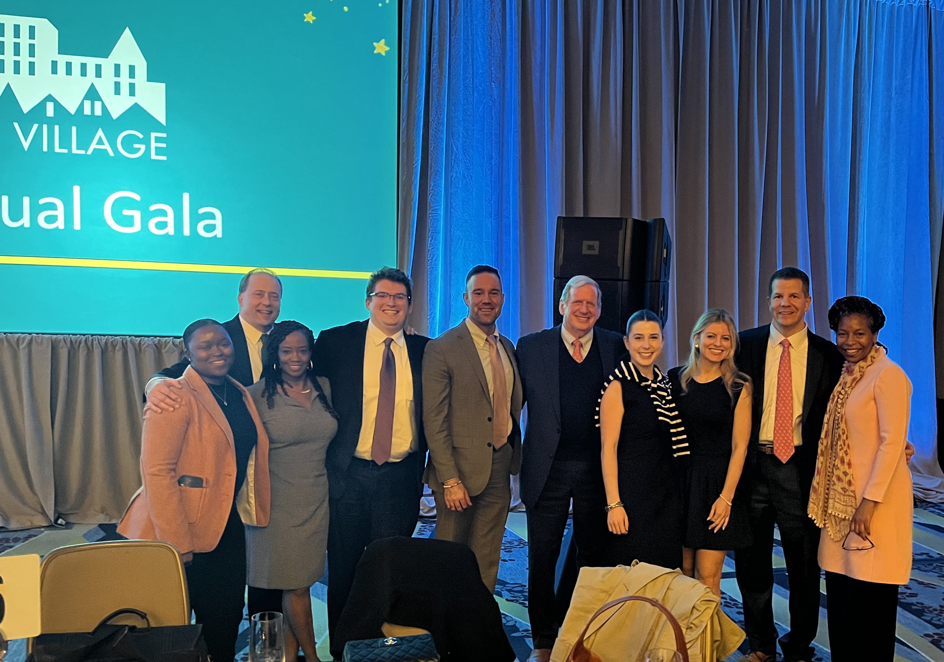 Stu Van Scoyoc standing with Van Scoyoc Associates colleagues at the 2024 N Street Village Annual Gala