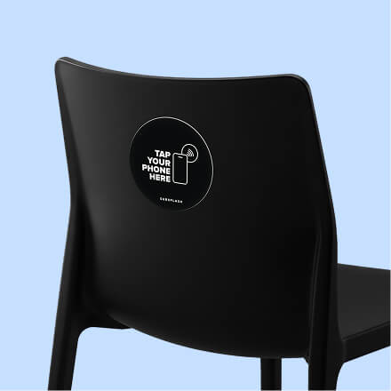 Subsplash Tap disc attached to the back of a black chair