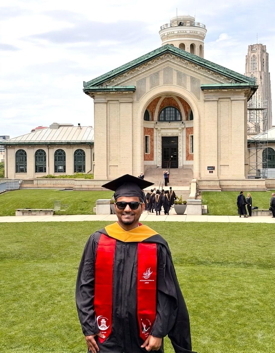 Suhail Khan in graduation robes on the Carnegie Mellon campus