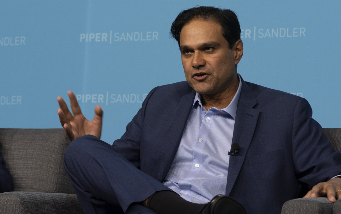 Sujay Jadhav speaking onstage at the Piper Sandler Heartland Summit in Minneapolis in 2022