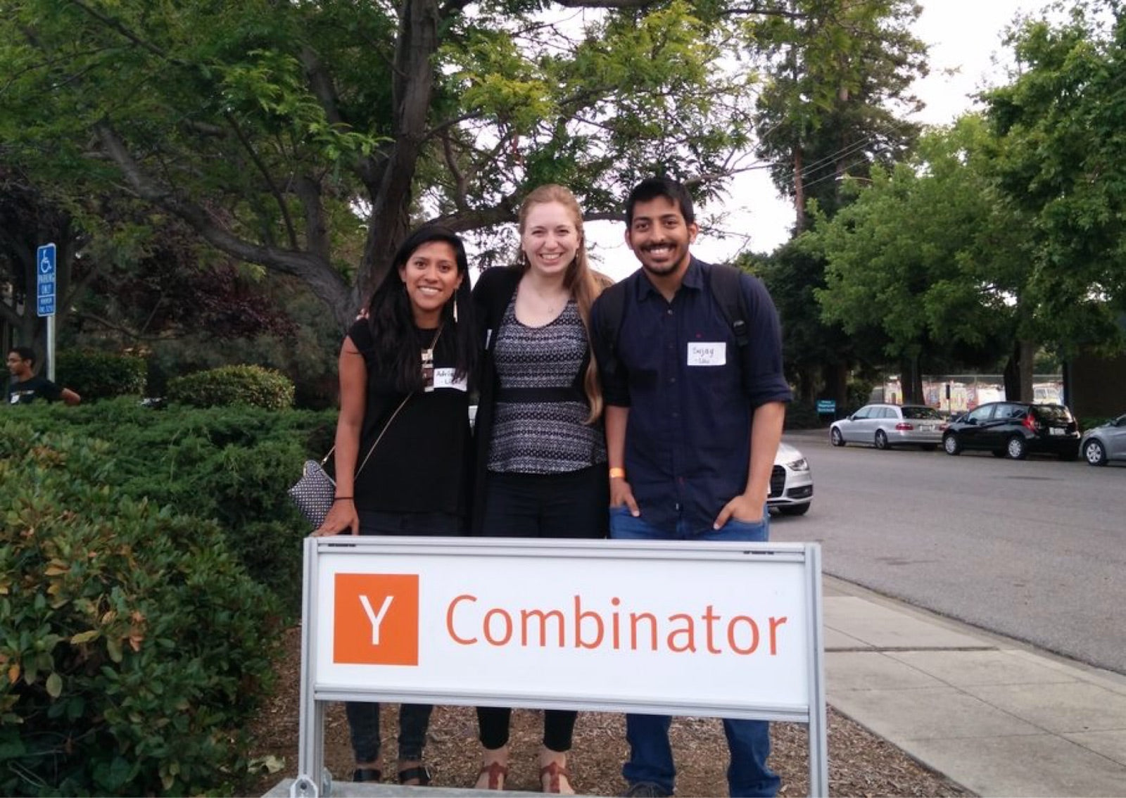 Adriana and Sujay standing with a fellow founder outside Y Combinator