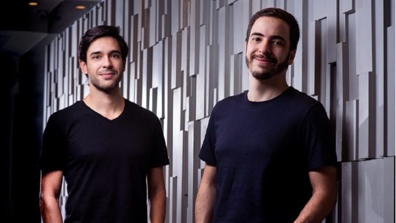 Merama co-founders Sujay Tyle and Felipe Delgado standing in an office corridor