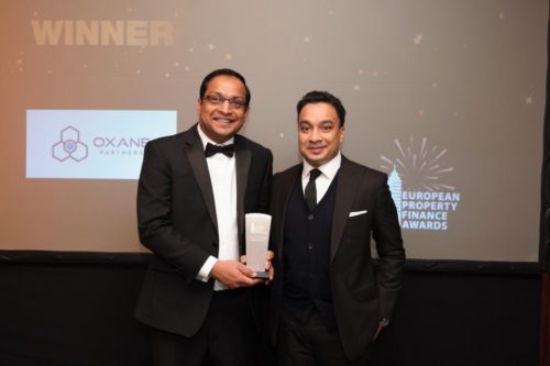 Yousuf Attarwala, left, and Sumit Gupta, right, holding Oxane’s award in Frankfurt