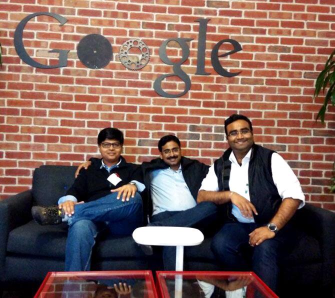 CommonFloor co-founders Lalit Mangal, Sumit Jain and Vikas Malpani seated together in front of a Google sign