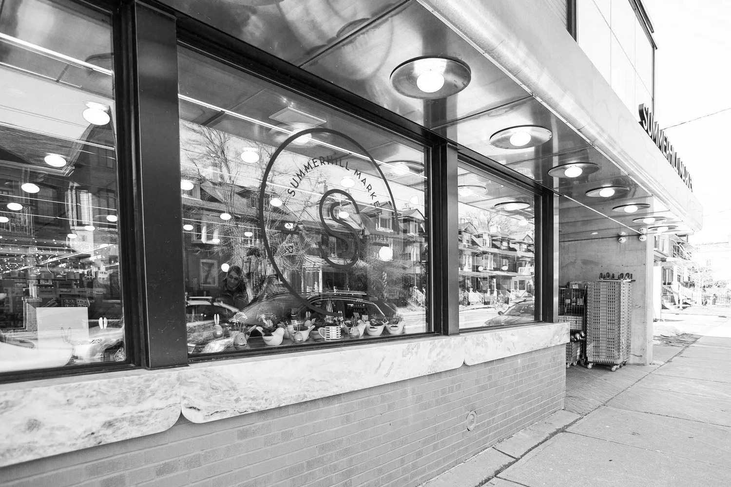 Black-and-white exterior photograph of a Summerhill Market storefront