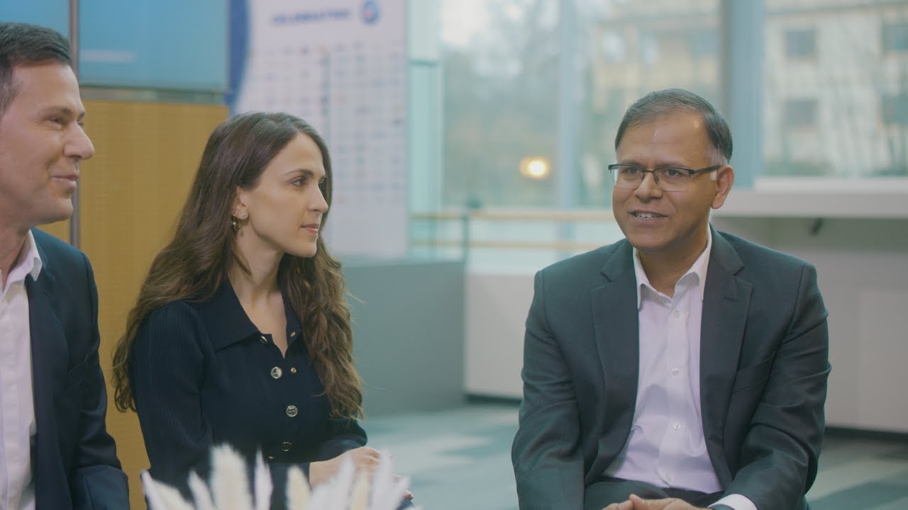 Sundar Raman, at right, in conversation with P&G colleagues