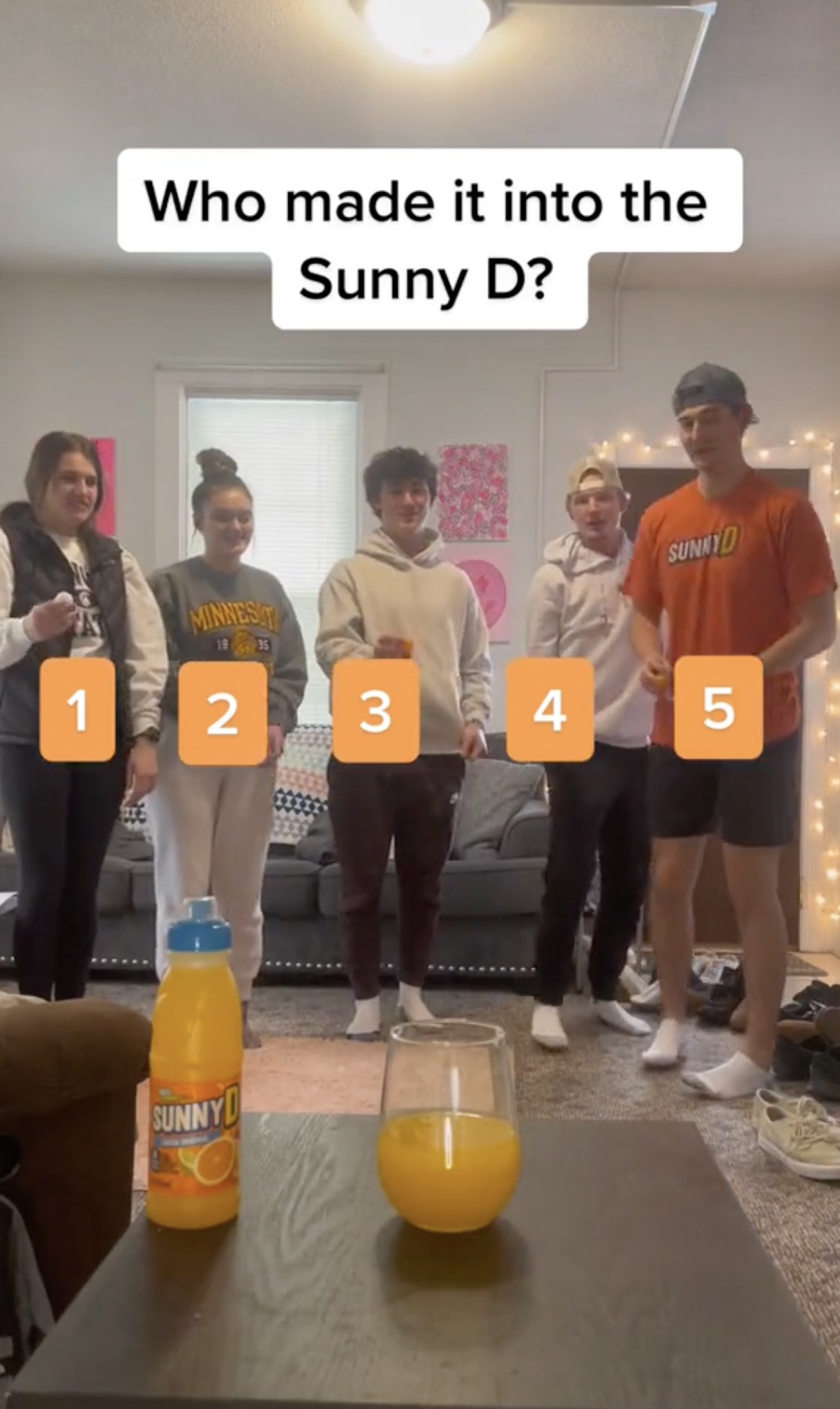 SUNNYD campaign screenshot showing five participants and a drink-based guessing challenge