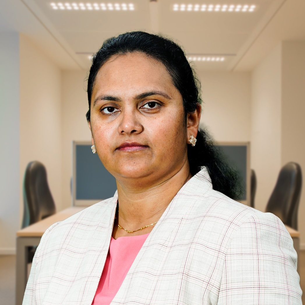 Surekha Reddy Pailla in a light checked blazer, in the portrait published for the InnovASIAN Symposium