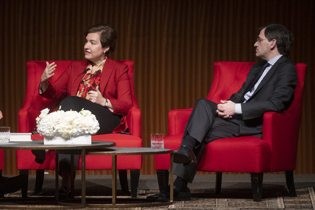 Susan Glasser and Peter Baker seated onstage in red chairs during a 2022 LBJ Presidential Library discussion