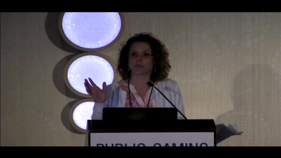 Susan Golightly speaking behind a lectern at SMART-TECH 2015 in New York City