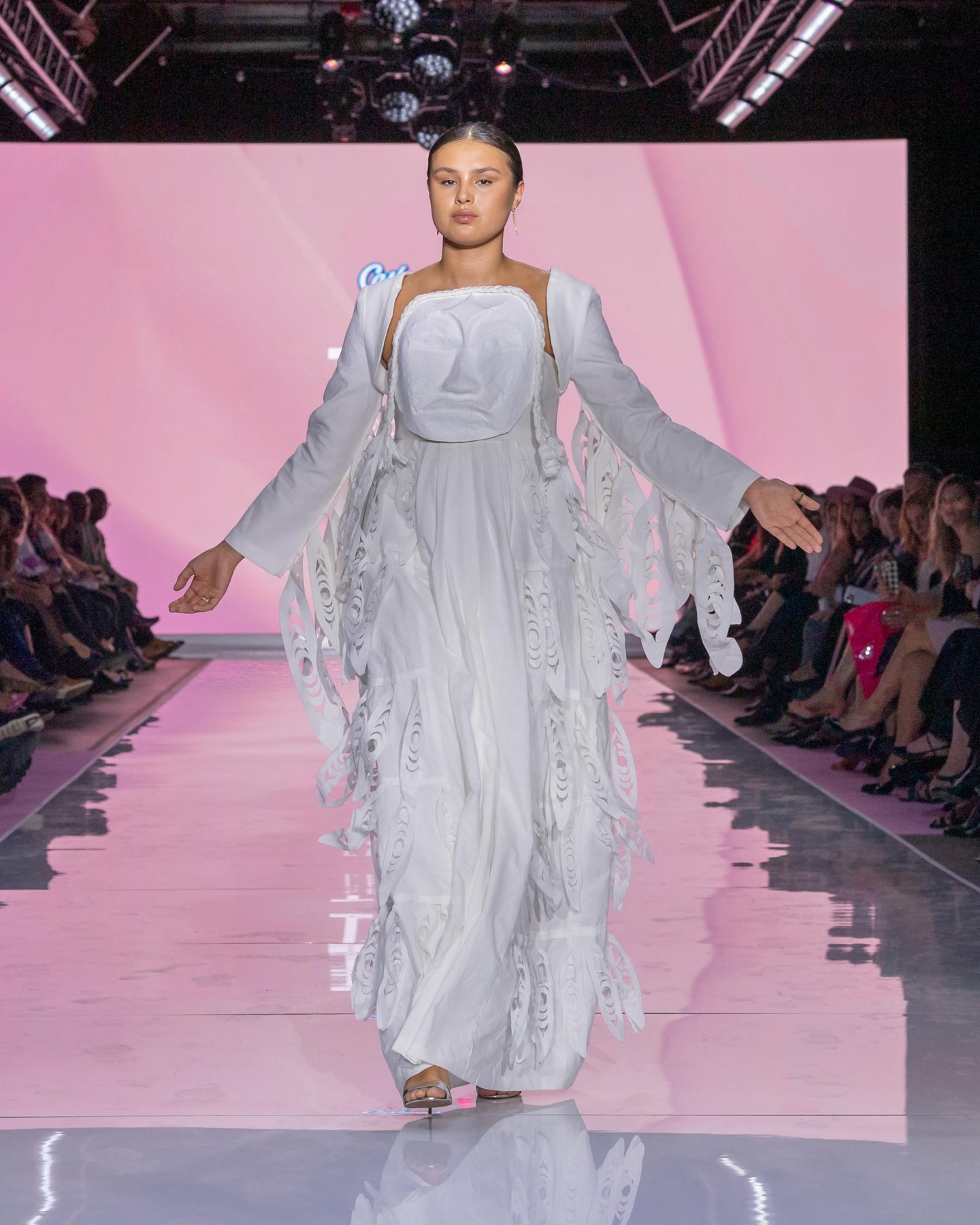 A model walks the illuminated runway at Kruger's 2024 Cashmere Collection show