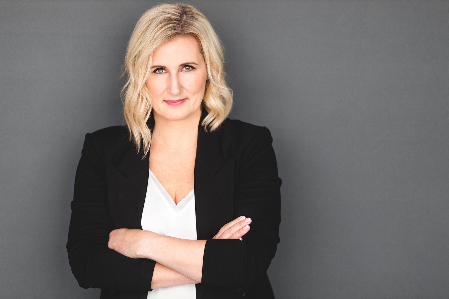 Susan Irving in an editorial portrait against a grey background
