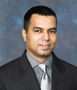Susheel John in a formal press portrait from 2014