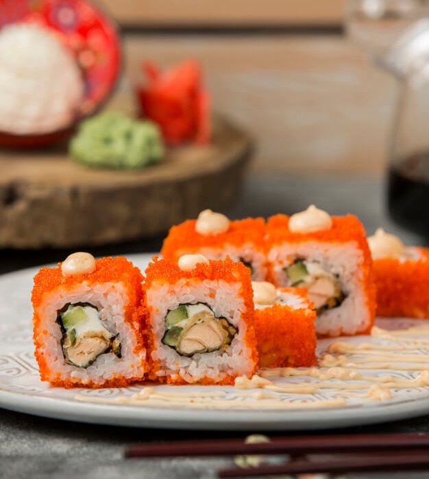 Sushi rolls with a bright orange coating, pictured on Top Sushi’s website