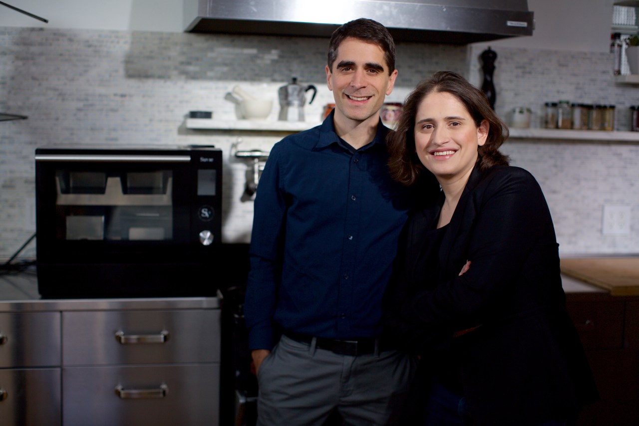 Suvie co-founders Robin Liss and Kevin Incorvia beside an early Suvie appliance