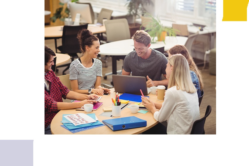 Illustrative office scene from SwankTek’s careers page, showing a group gathered around a laptop
