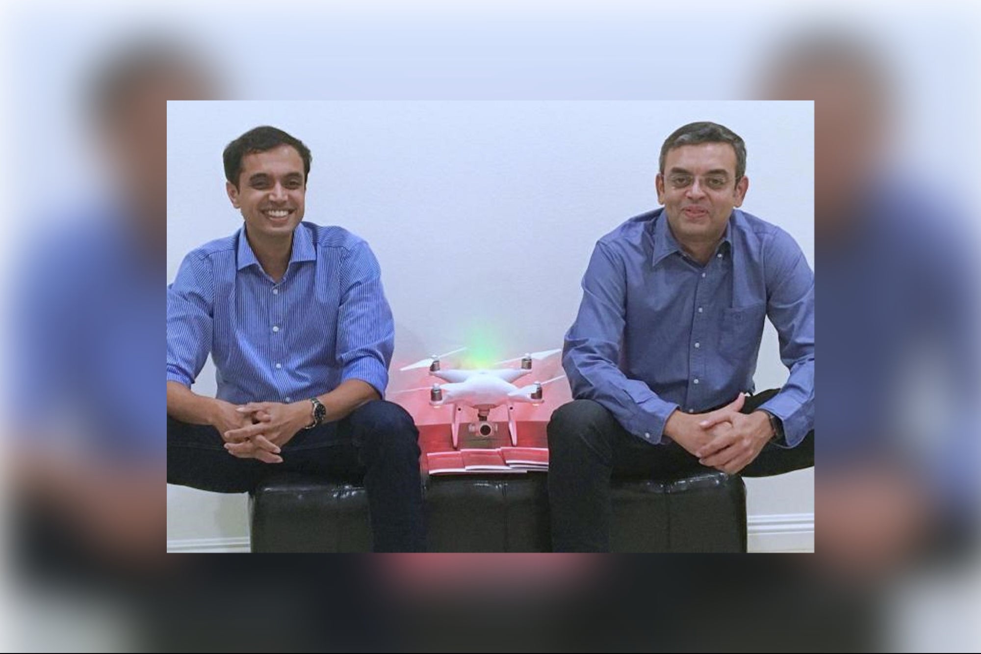 SenseHawk co-founders Swarup Mavanoor and Rahul Sankhe seated beside a drone
