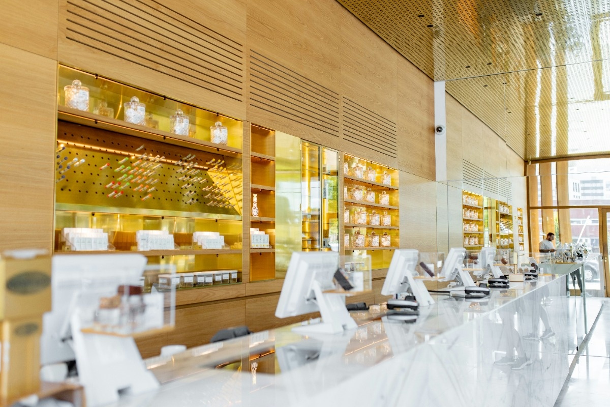 A bright dispensary interior with a long row of checkout stations